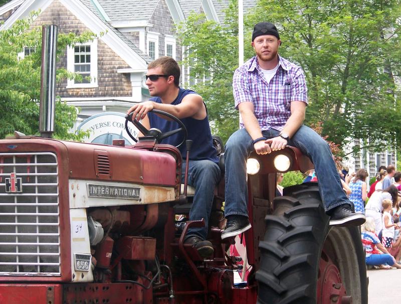 Andrew Cioper of Acushnet drives while Nick Procopio of Rehoboth relaxes. The tractor took second place in its category. BY MATTHEW BERNAT